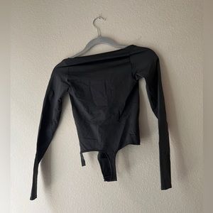 Skims bodysuit new but no tags has Santi pad. Dark Greg size S/M